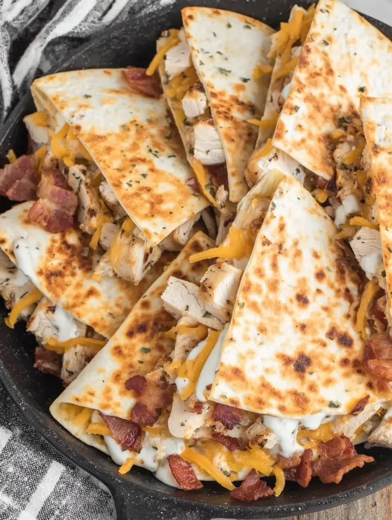A plate of chicken and bacon.