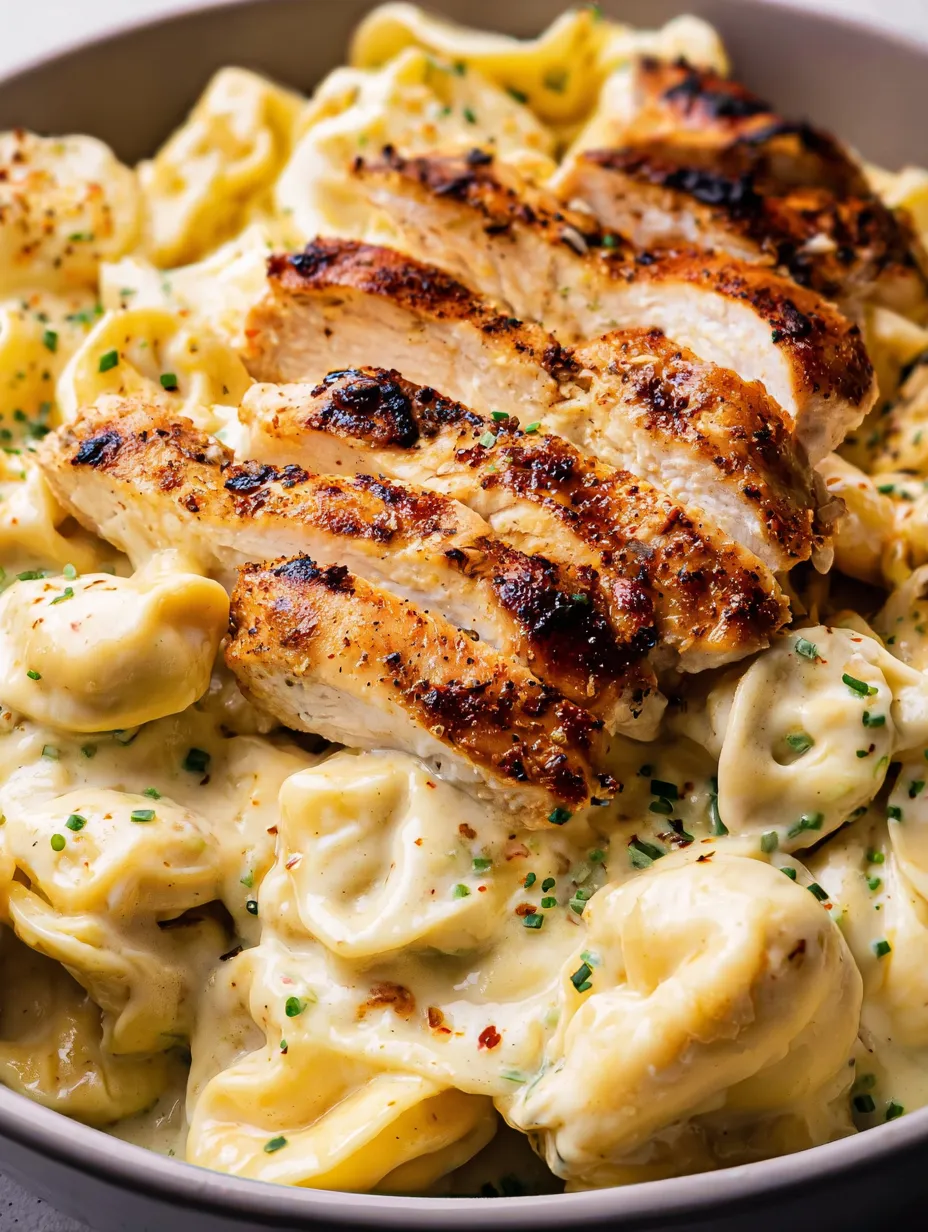 Chicken with pasta on a plate.