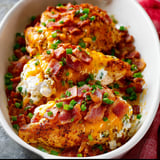 A bowl full of bacon with cheese on top.