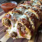 A loaded pizza topped with cheese and pepperoni.