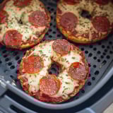 Grill holding two pepperoni bagels.