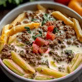 A cozy bowl with pasta, beef, and Rotel tomatoes.