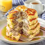 Stack of pancakes topped with meat and cheese.
