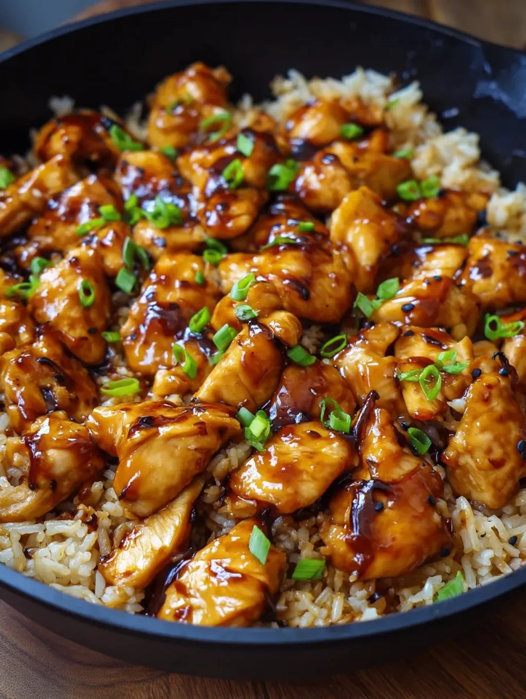 A plate with meat and rice on it.