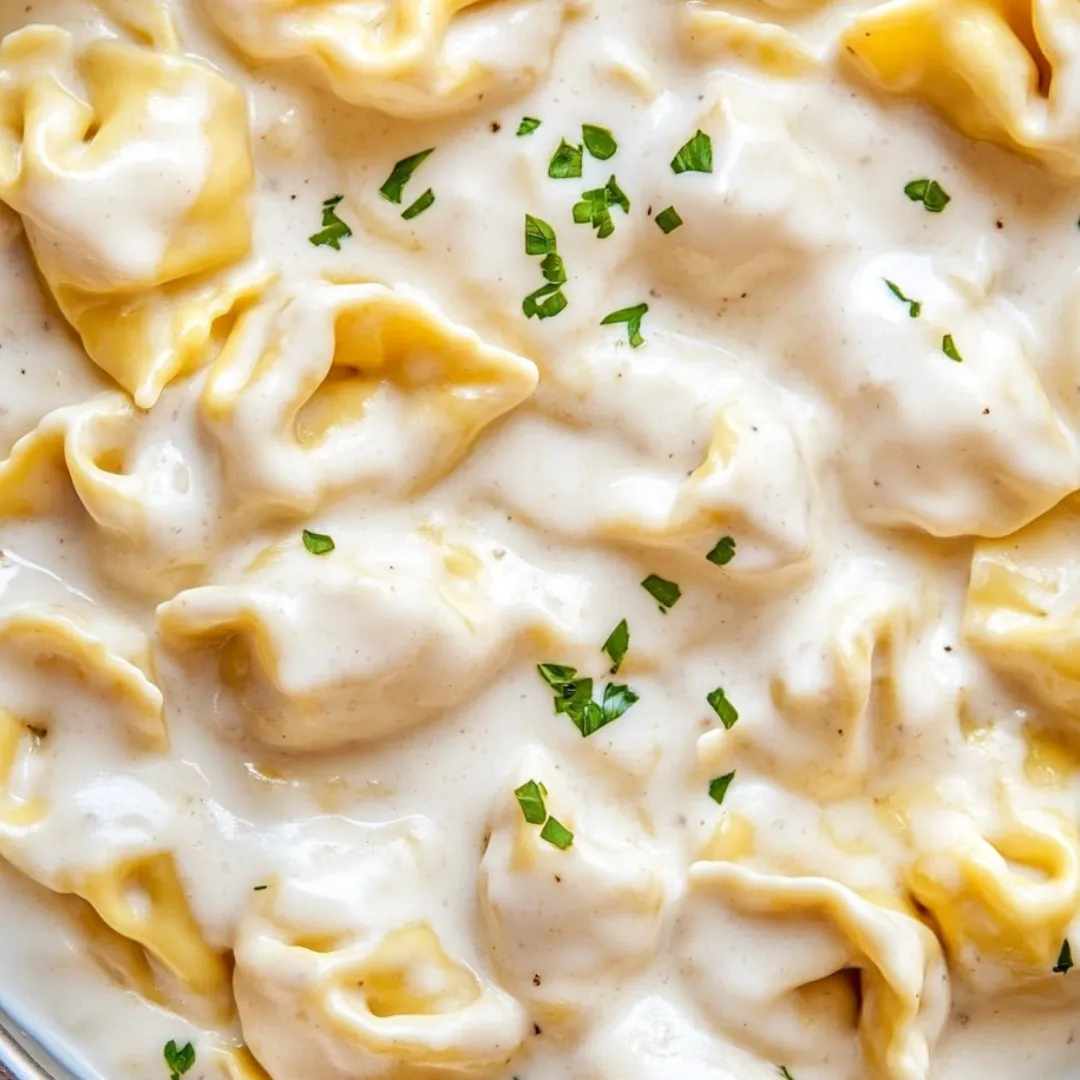 Pasta bowl topped with fresh herbs.