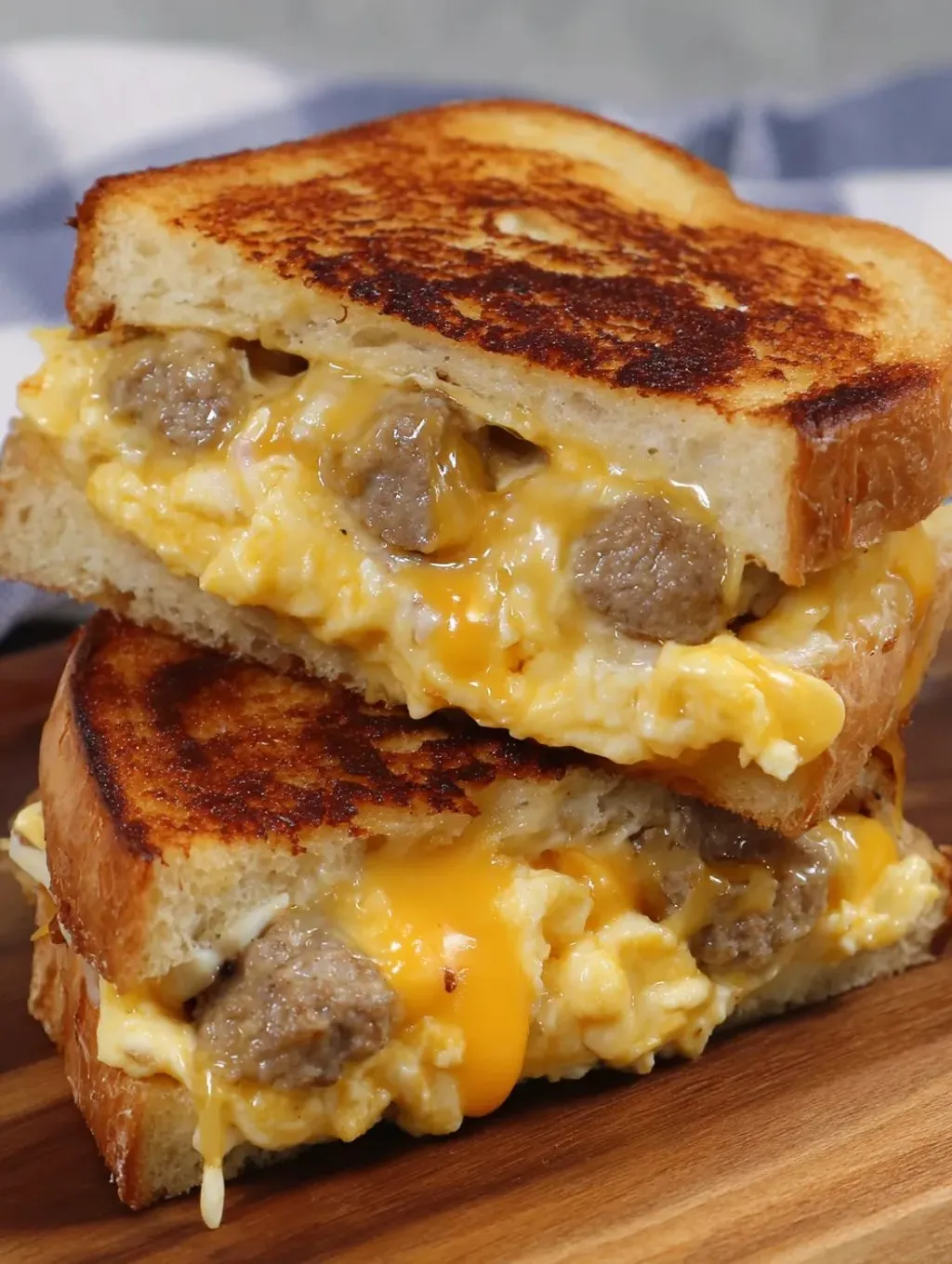 A sandwich with sausage and melty cheese.
