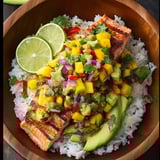 A bowl of food with fish, rice, and vegetables.