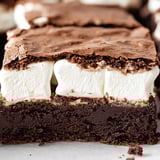 A slice of chocolate cake with white frosting.