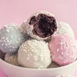 A bowl of candy balls with one missing.