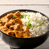 A bowl of rice and meat.