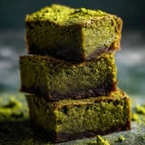 A stack of three green brownies, one on top of the other.