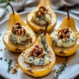 Pear halves topped with blue cheese and walnuts.