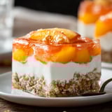A peach cobbler slice served on a plate.