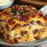Bacon and cheesy lasagna on a plate.