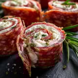 Cheesy meat rolls on a platter.